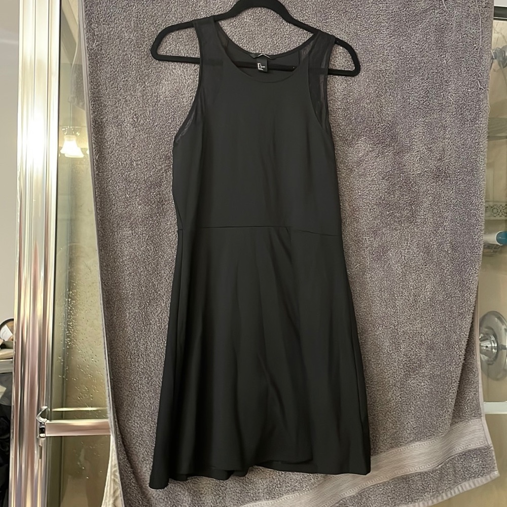 Classic little black dress with a slight lace shoulder